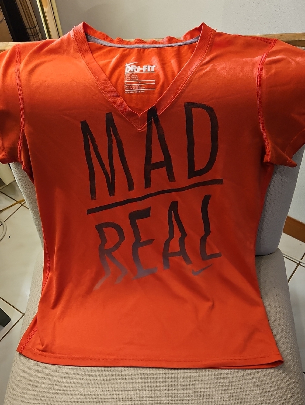 Nike Orange V-Neck 'MAD REAL' Graphic Short Sleeve Tee